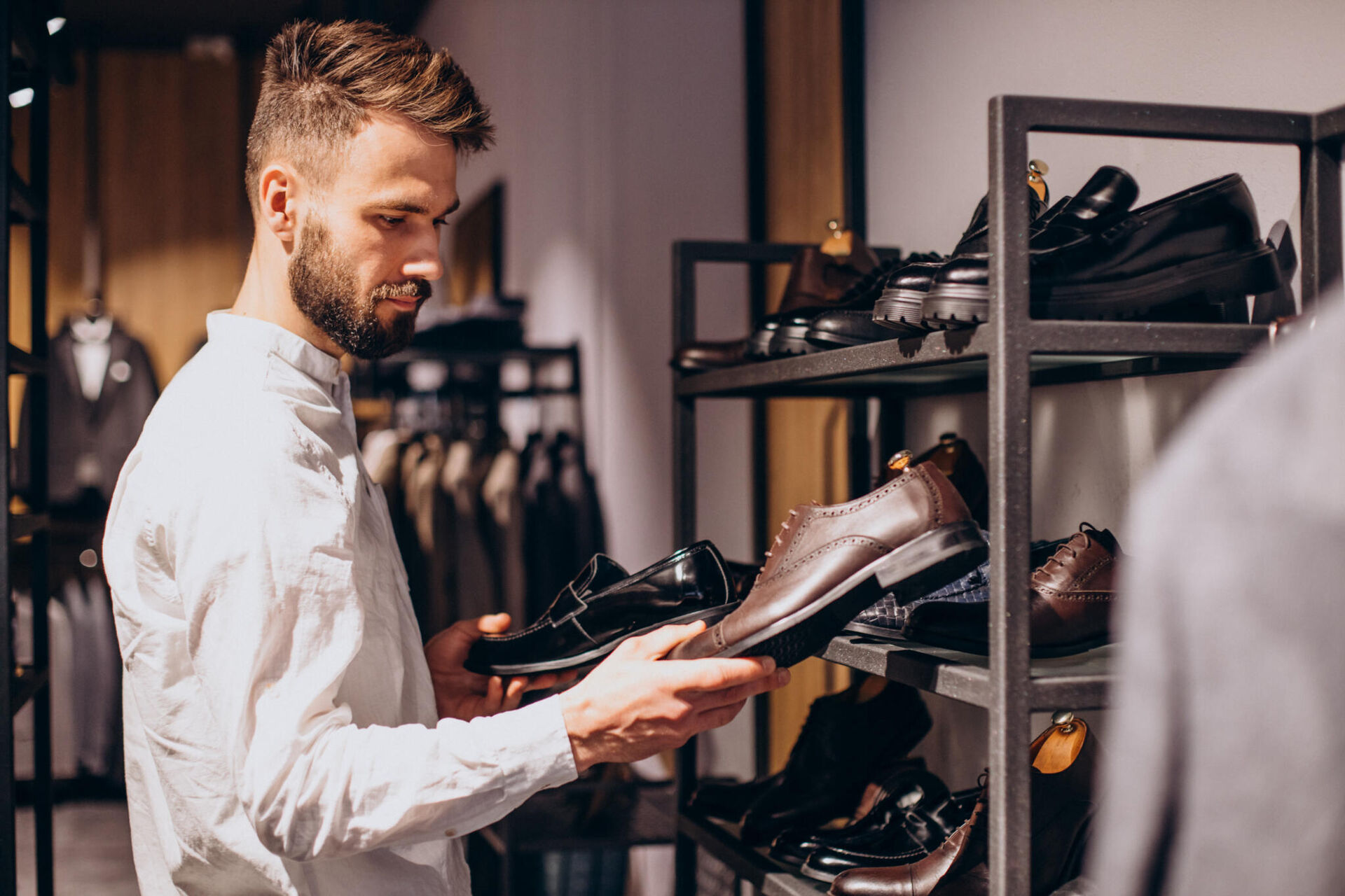 man-choosing-foot-wear-mens-store