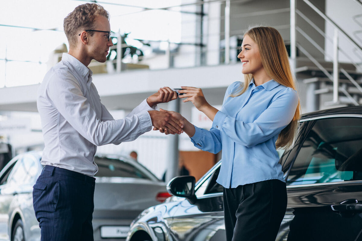 customer-making-purchase-car-showroom