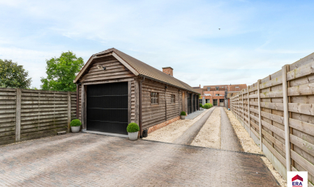 Handelspand met woonst op 1.150 m² in centrum Aarsele!  image
