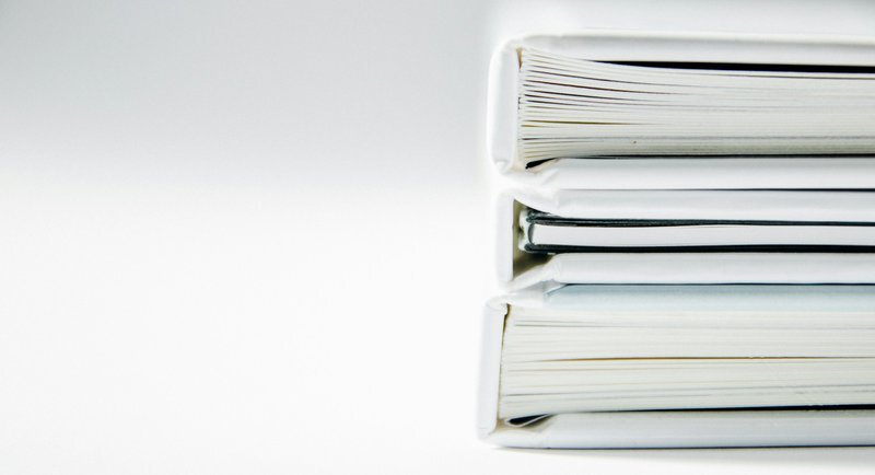 a-stack-of-thick-folders-on-a-white-surface-xn4t2pvuugk_425cdc49cbe25574c5f5de965a66b934_800