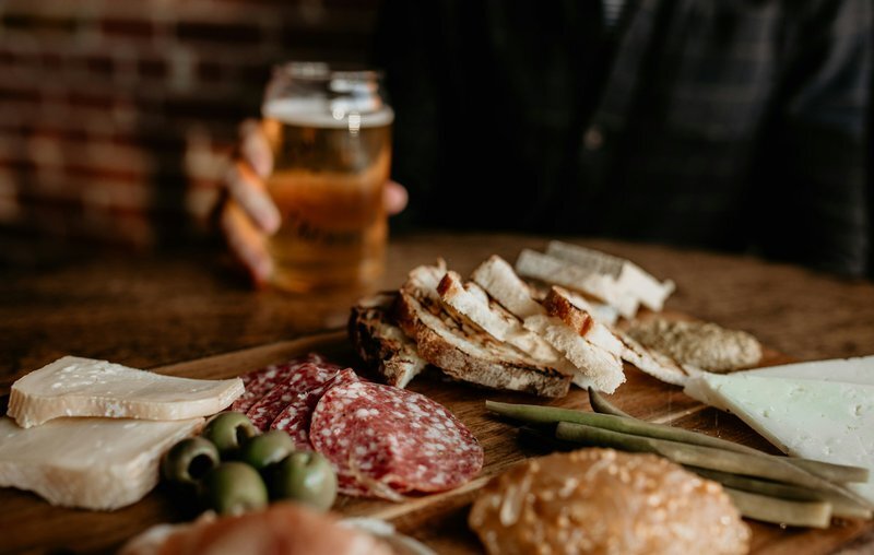 a-wooden-table-topped-with-lots-of-different-types-of-food-ecgrbdzxyom_0e604b84a6620660ca7e5e14758e873b_800